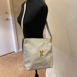 Vintage Paloma Picasso soft ivory leather shoulder bag with zipper closure.